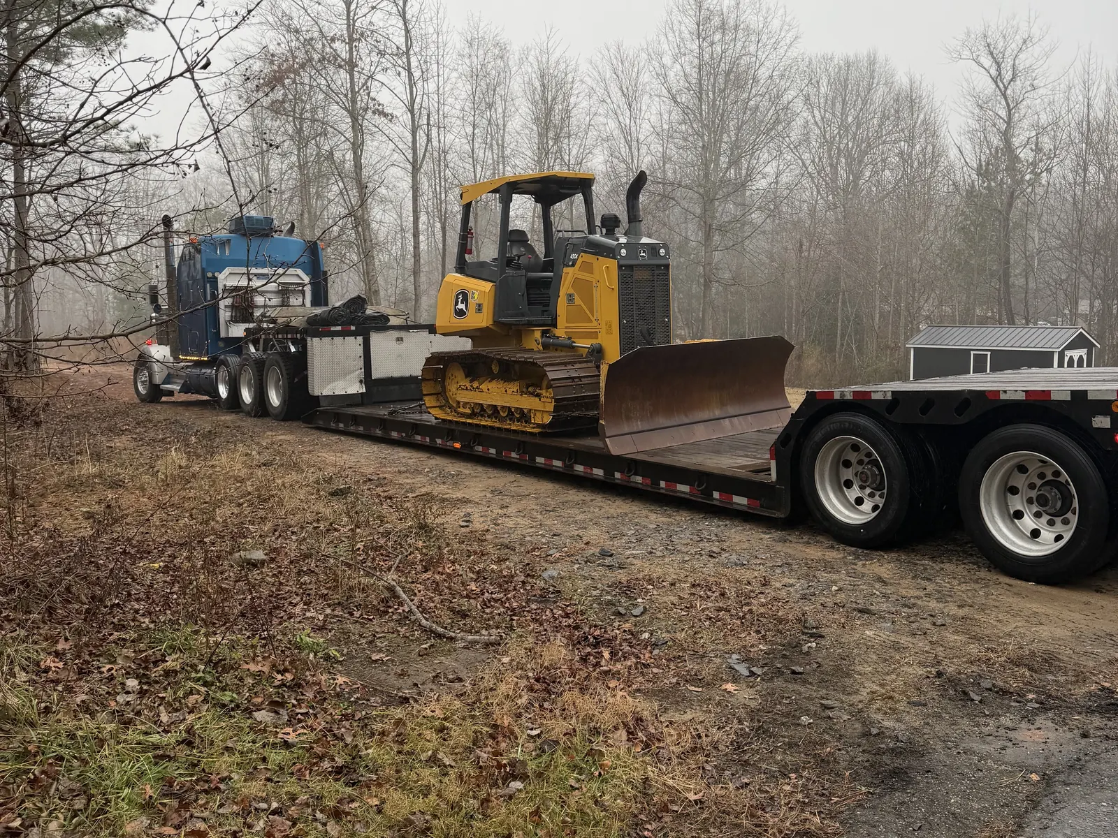 Dozer loaded on a lowboy trailer for the move to a job site